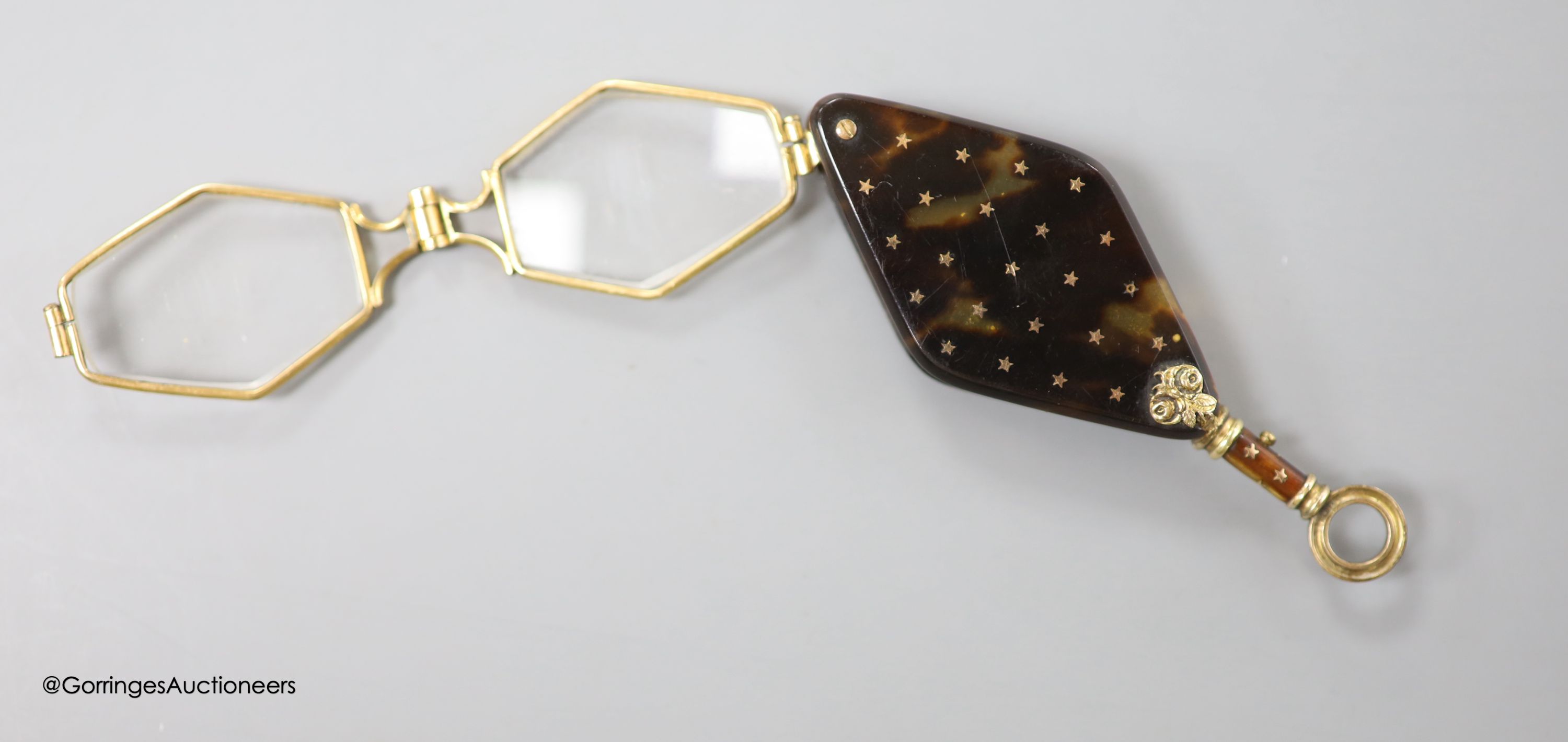 A pair of 19th century French tortoiseshell pique mounted yellow metal overlaid lorgnettes, 82mm.